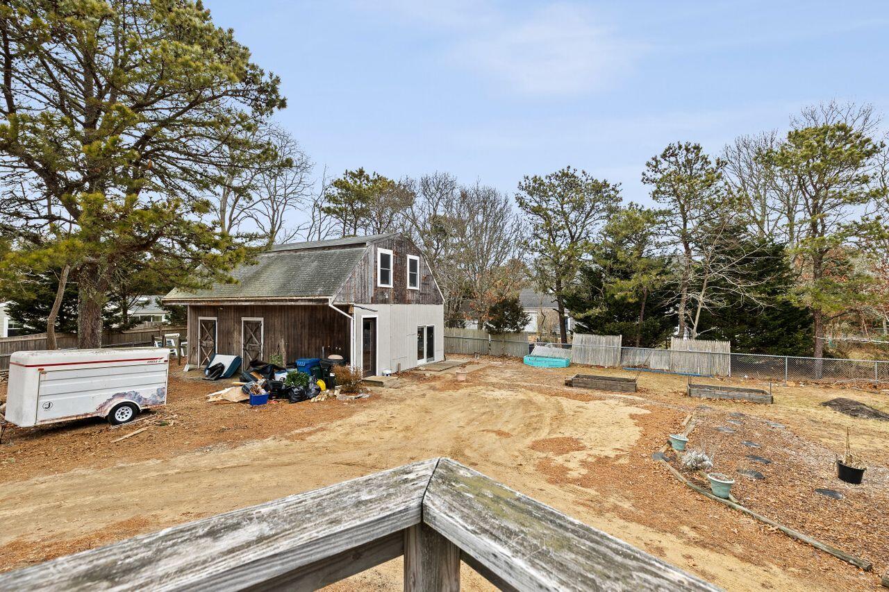 1460 Massasoit Road Eastham, MA 02642 - Photo 39 of 42 a view of a house with snow on the wall
