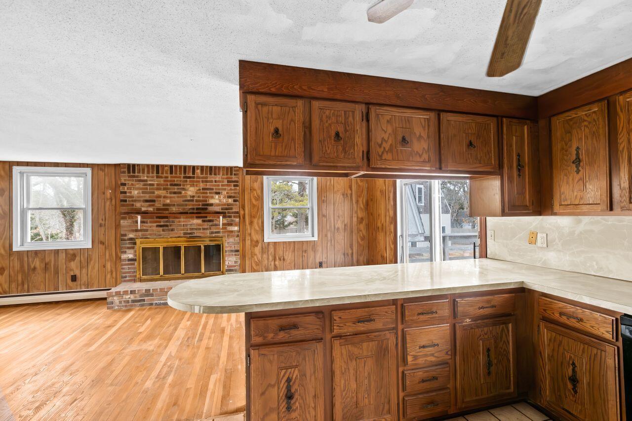 1460 Massasoit Road Eastham, MA 02642 - Photo 5 of 42 a kitchen with stainless steel appliances granite countertop a sink and cabinets