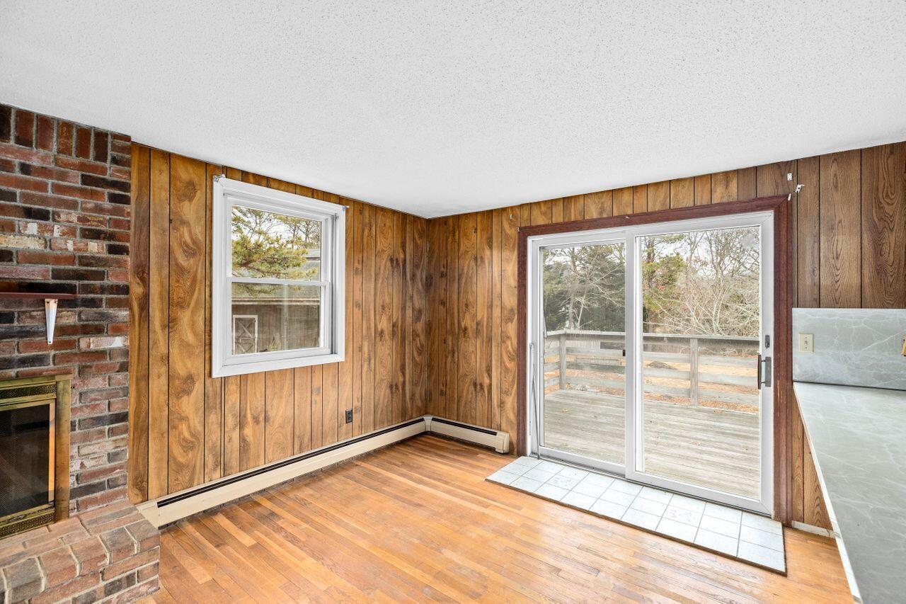 1460 Massasoit Road Eastham, MA 02642 - Photo 8 of 42 a view of an empty room and a window