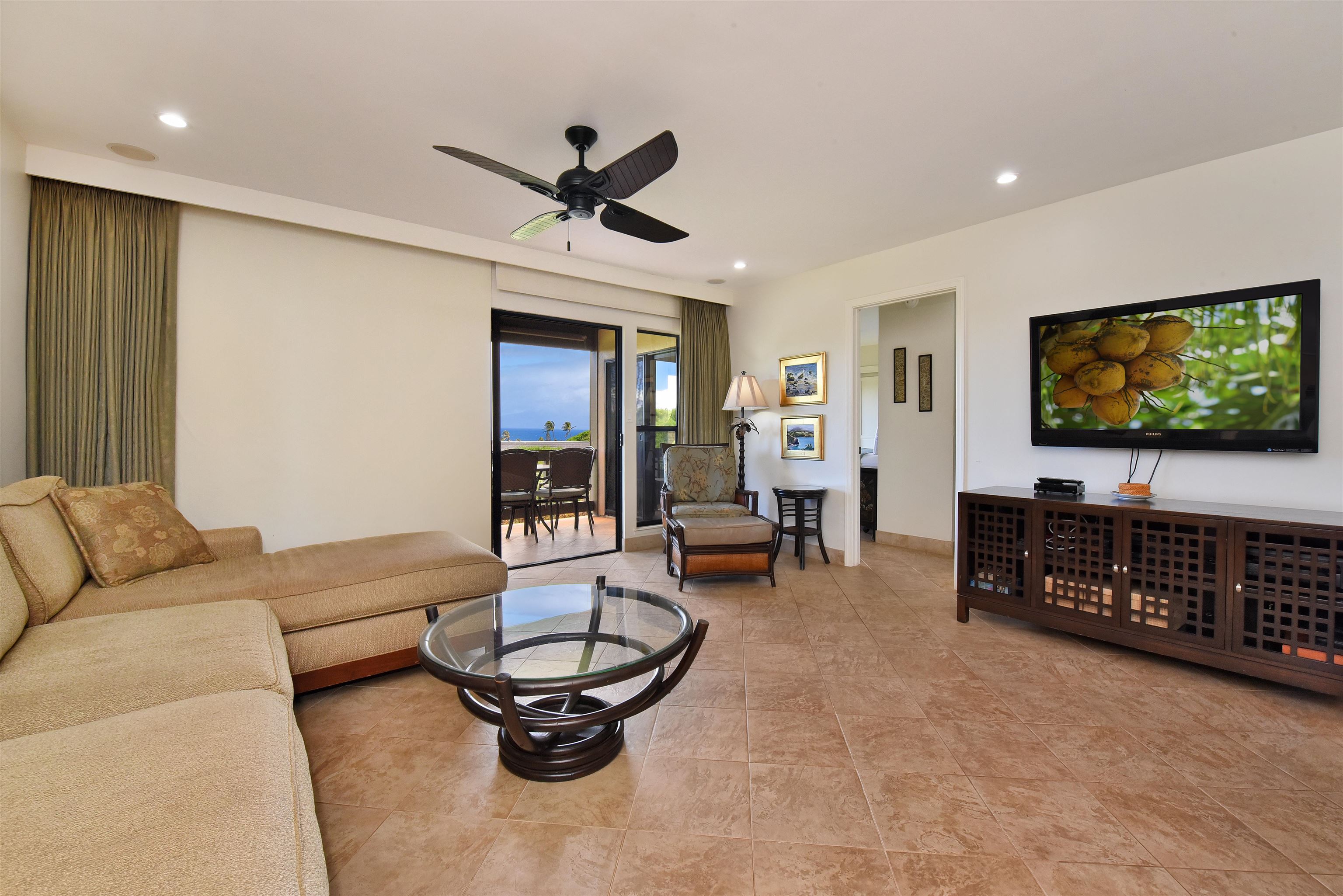 150 Puukolii Road, Unit 52 Lahaina, HI 96761 - Photo 16 of 50 a living room with furniture and a flat screen tv