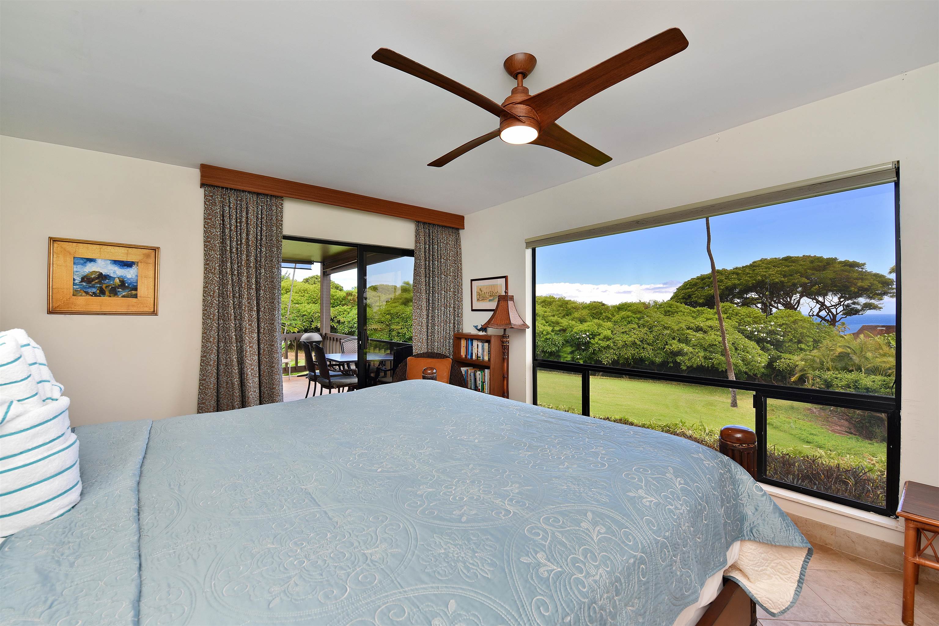 150 Puukolii Road, Unit 52 Lahaina, HI 96761 - Photo 22 of 50 a bedroom with a bed and large window