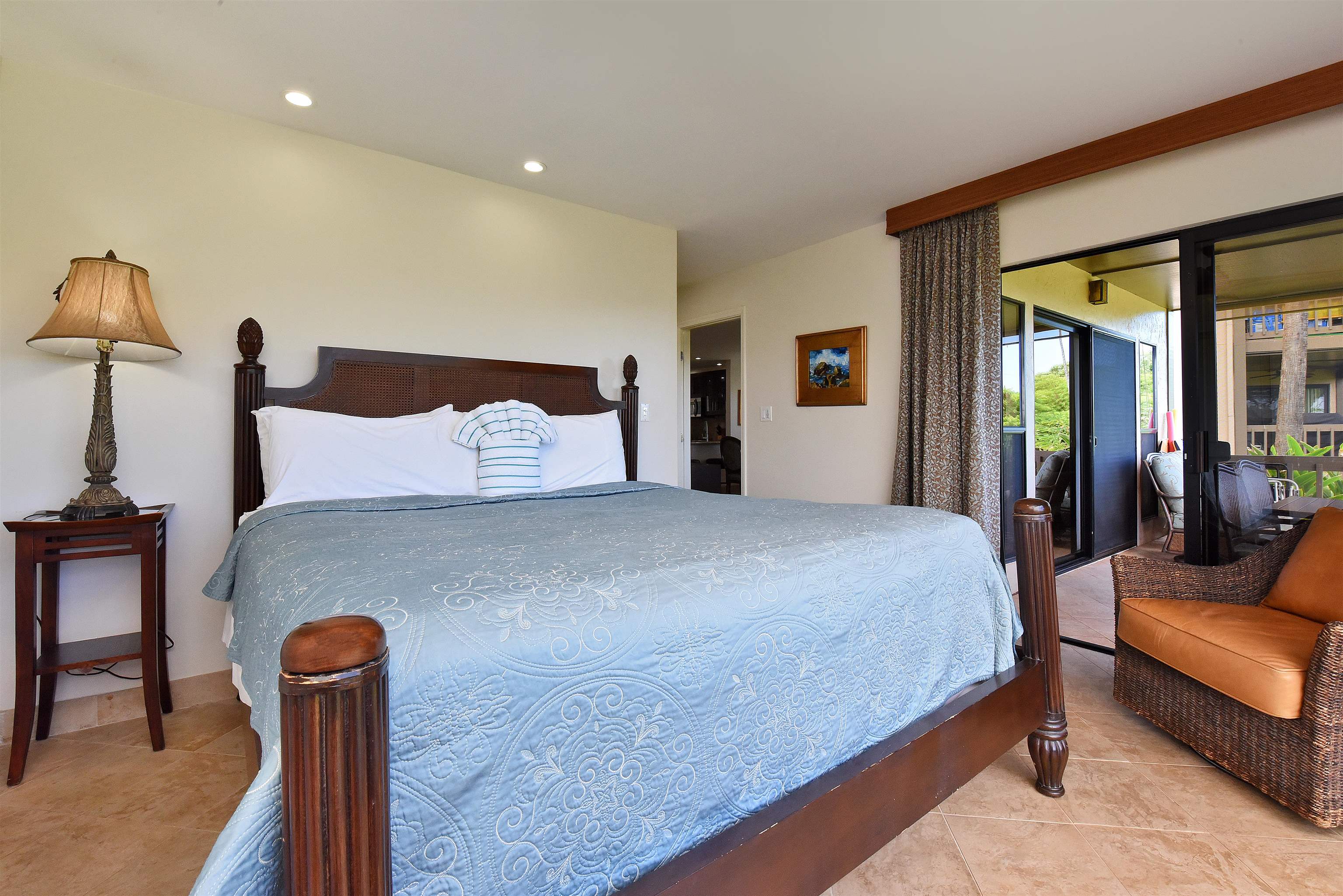 150 Puukolii Road, Unit 52 Lahaina, HI 96761 - Photo 23 of 50 a bedroom with furniture and a lamp