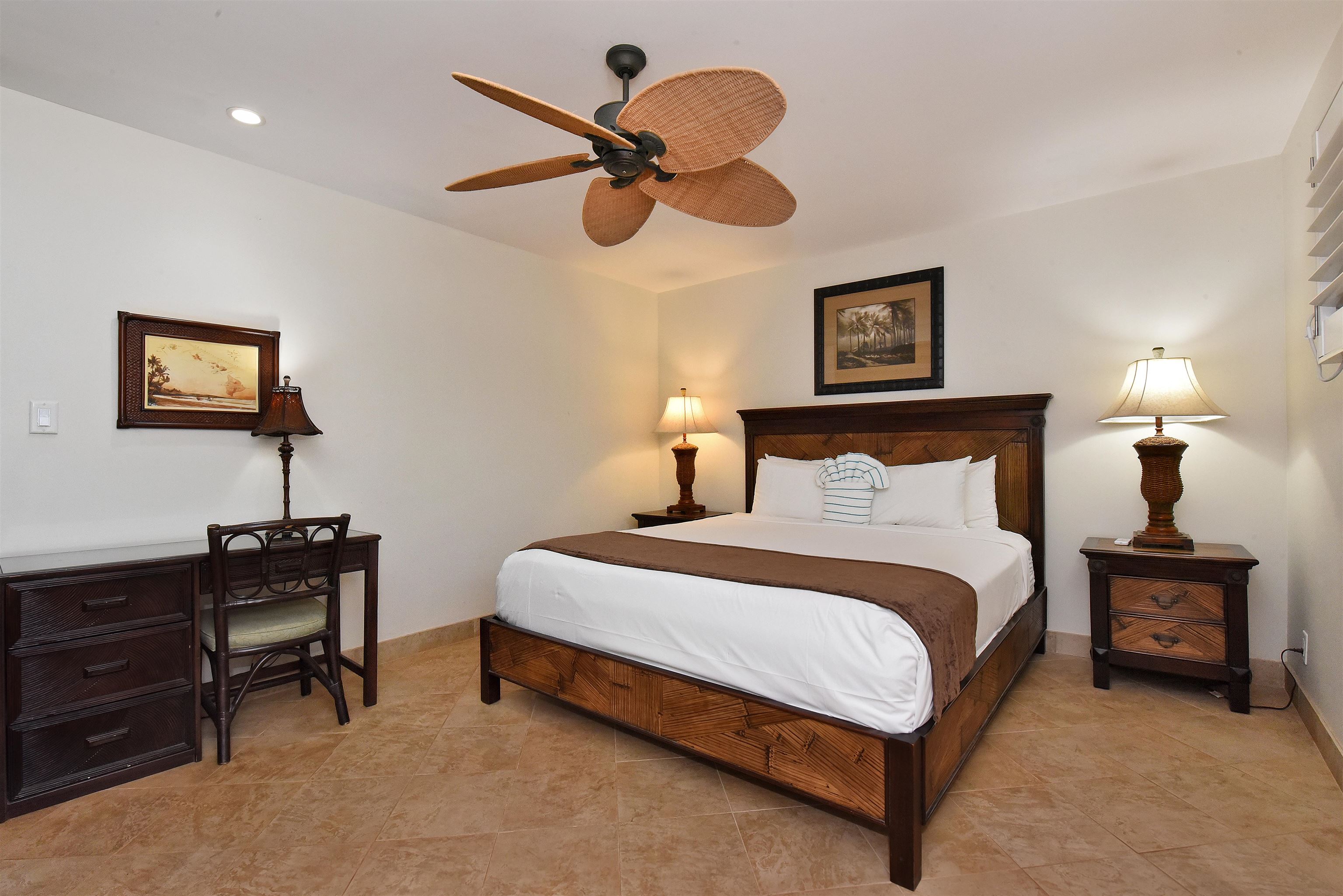 150 Puukolii Road, Unit 52 Lahaina, HI 96761 - Photo 38 of 50 a bedroom with a bed and a chandelier