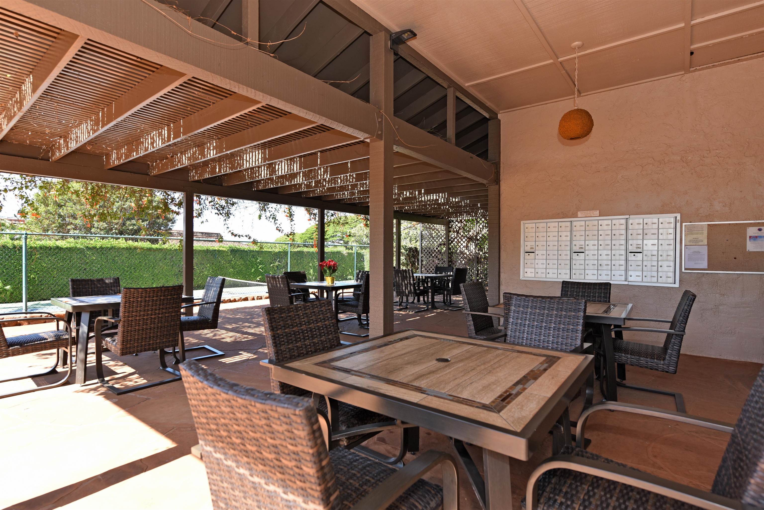 150 Puukolii Road, Unit 52 Lahaina, HI 96761 - Photo 46 of 50 a view of a dining table and chairs in the patio