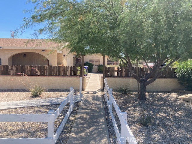 13237 Mohawk Road Apple Valley, CA 92308 - Photo 2 of 21 a front view of a house with a yard