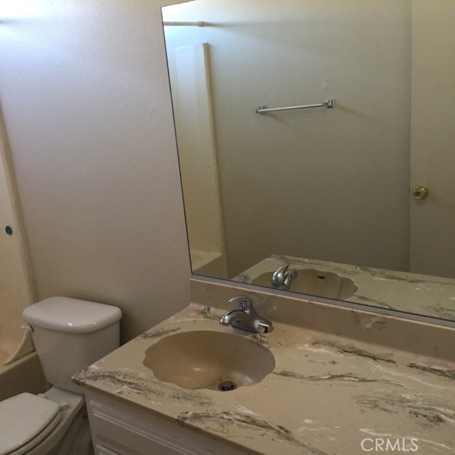13237 Mohawk Road Apple Valley, CA 92308 - Photo 7 of 21 a bathroom with a sink and toilet