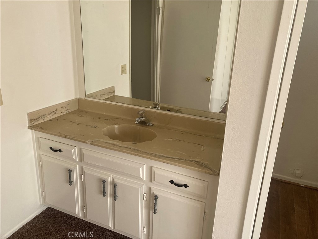 13237 Mohawk Road Apple Valley, CA 92308 - Photo 10 of 21 a bathroom with a sink and vanity