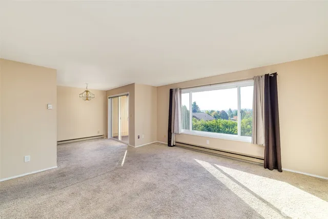 an empty room with windows and view