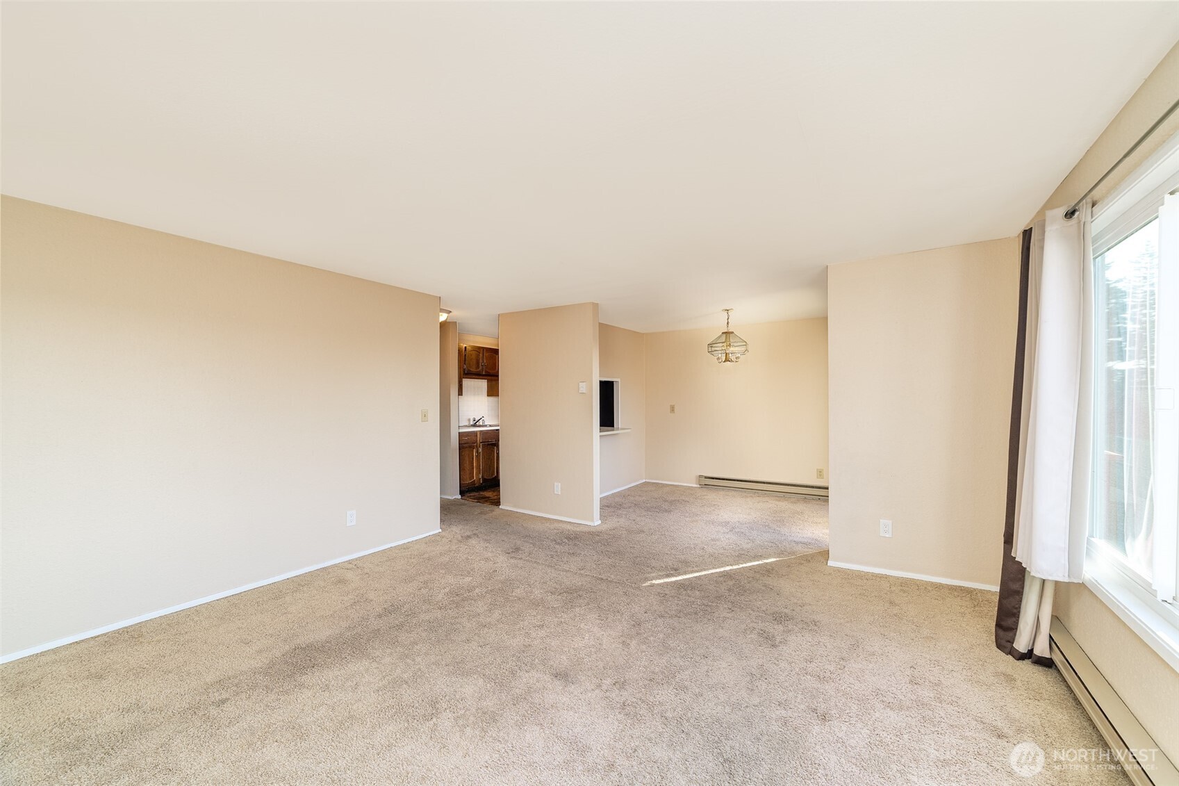 221 Southwest 154th Street, Unit 8 Burien, WA 98166 - Photo 4 of 10 an empty room with windows