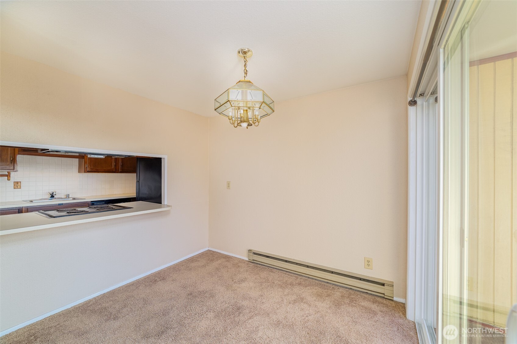 221 Southwest 154th Street, Unit 8 Burien, WA 98166 - Photo 6 of 10 a kitchen with stainless steel appliances granite countertop a refrigerator and a stove top oven