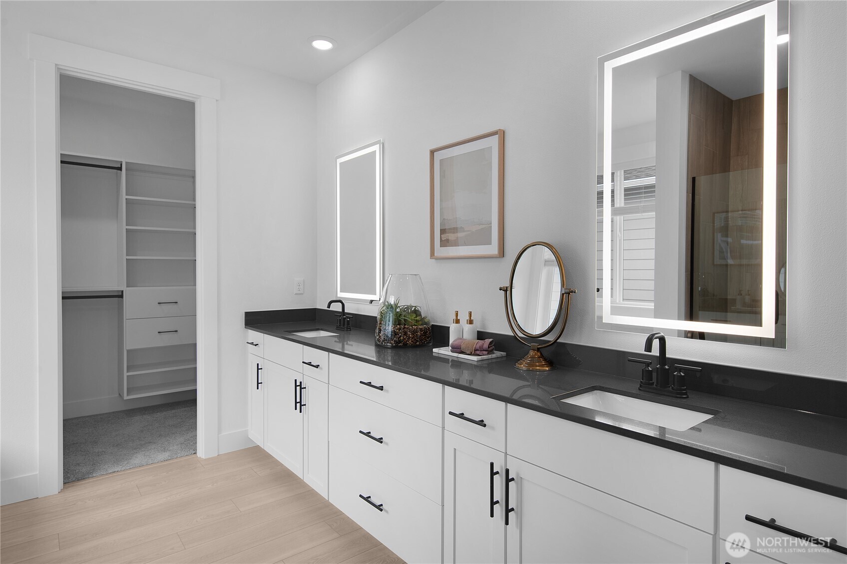 616 Sunbeam Place Sequim, WA 98382 - Photo 17 of 26 a bathroom with double sink and a mirror