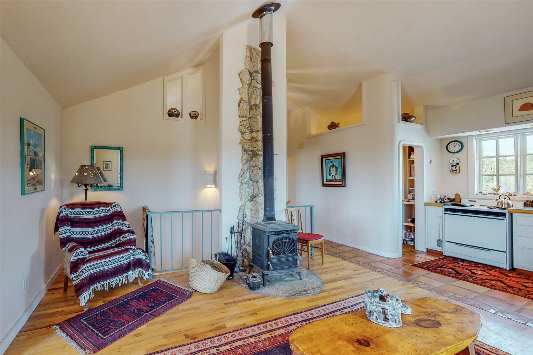 175 Hidden Valley Ranch Road Ilfeld, NM 87538 - Photo 26 of 43 Livingroom showing woodstove, maple stairs