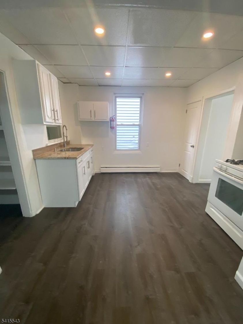61 Highland Street Paterson, NJ 07524 - Photo 11 of 13 a view of kitchen and windows