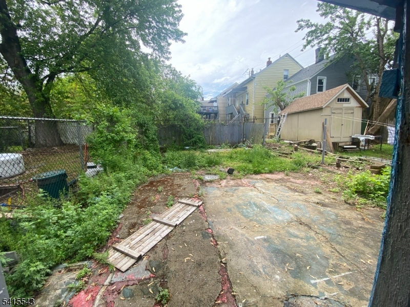 61 Highland Street Paterson, NJ 07524 - Photo 12 of 13 a backyard of a house