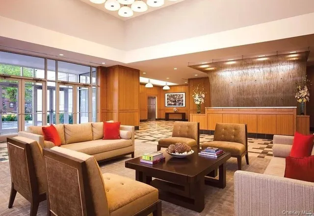 a living room with furniture and a large window