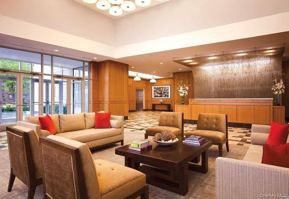 40-26 College Point Boulevard Queens, NY 11354 - Photo 4 of 10 a living room with furniture and a large window