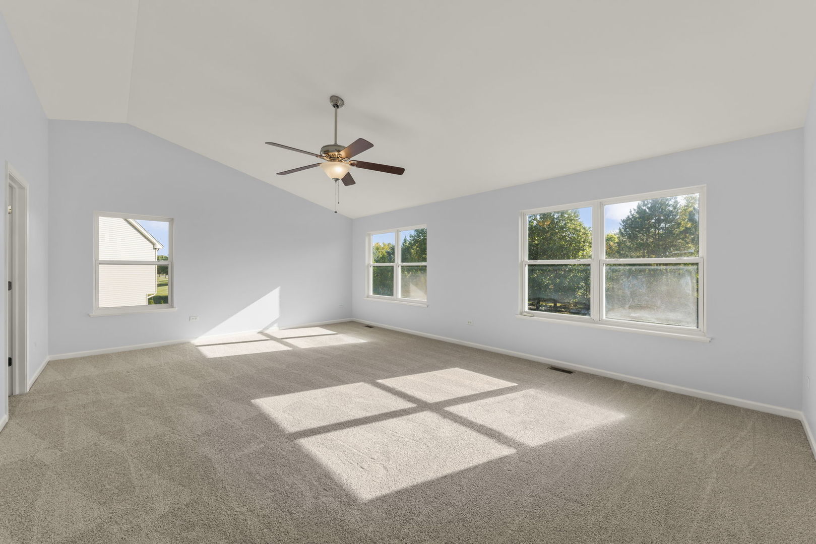 5 Player Court Bolingbrook, IL 60490 - Photo 17 of 37 a view of a livingroom with a ceiling fan and window