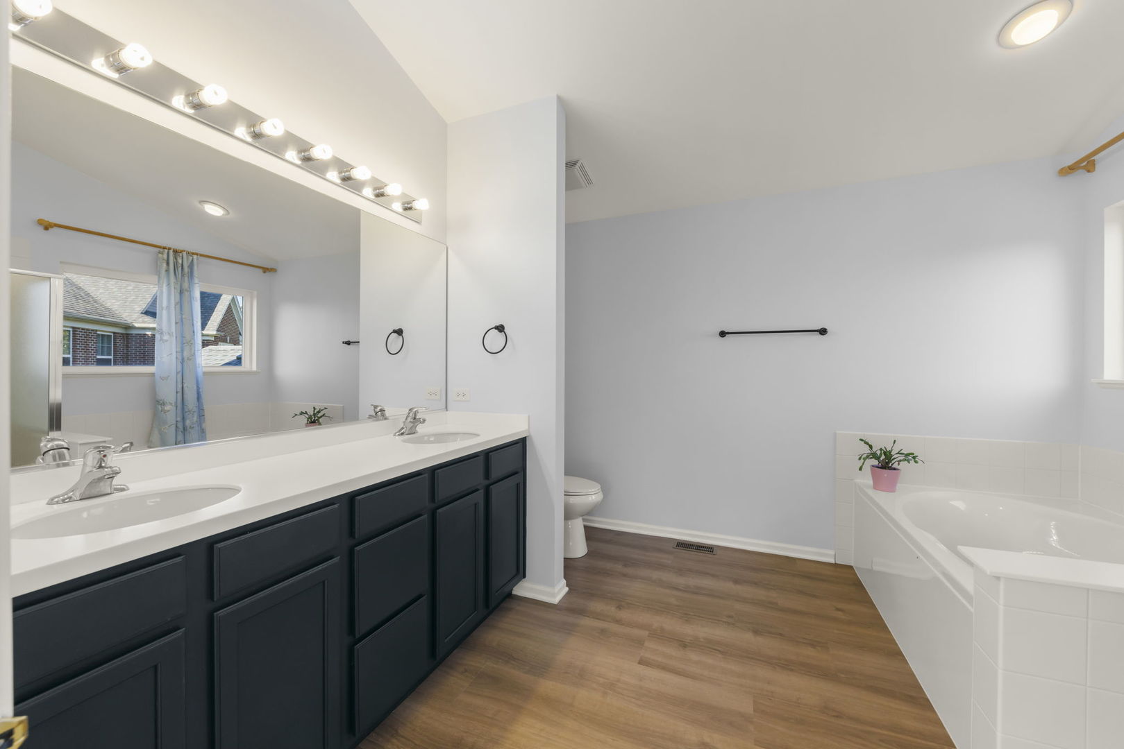 5 Player Court Bolingbrook, IL 60490 - Photo 19 of 37 a spacious bathroom with a double vanity sink a large mirror and shower