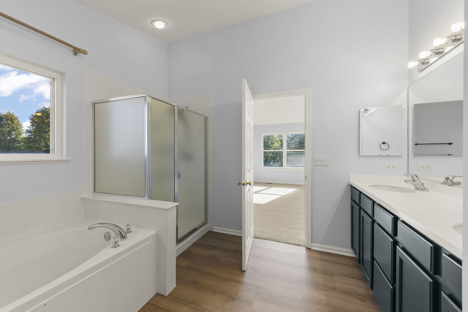 5 Player Court Bolingbrook, IL 60490 - Photo 20 of 37 a bathroom with a tub sink and a mirror