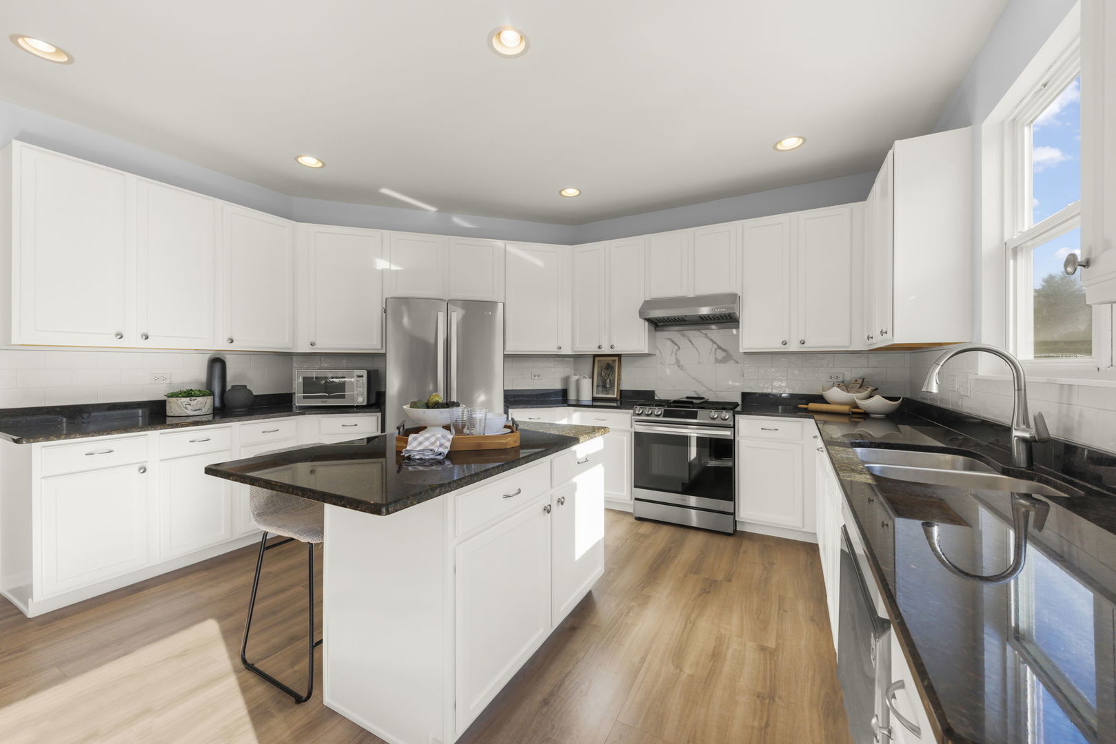 5 Player Court Bolingbrook, IL 60490 - Photo 8 of 37 a kitchen with stainless steel appliances granite countertop a sink stove and cabinets
