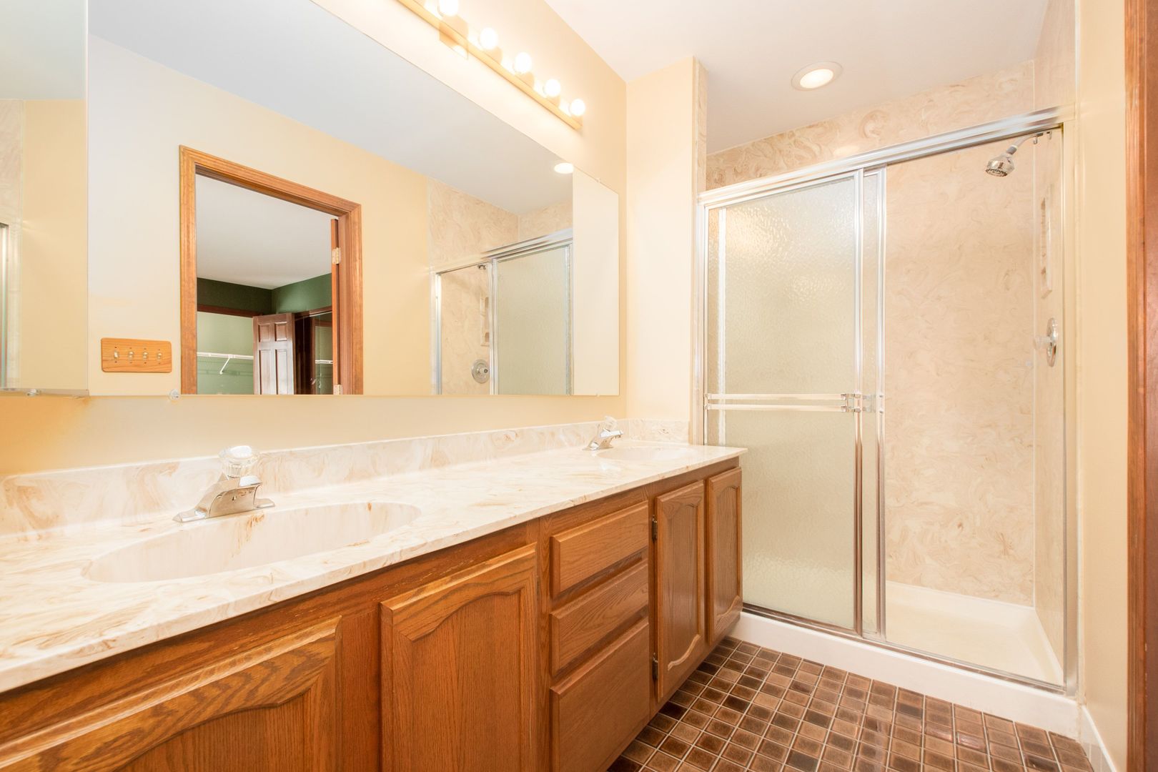 466 River Front Circle Naperville, IL 60540 - Photo 12 of 17 a bathroom with a shower sink and mirror