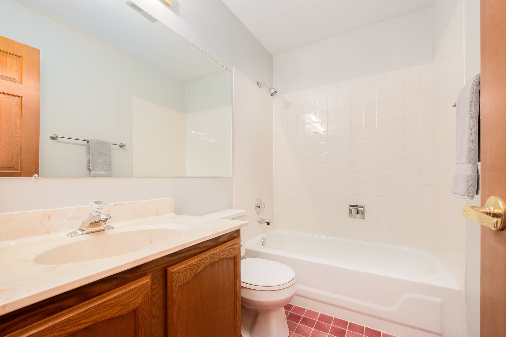 466 River Front Circle Naperville, IL 60540 - Photo 15 of 17 a bathroom with a sink a toilet and shower