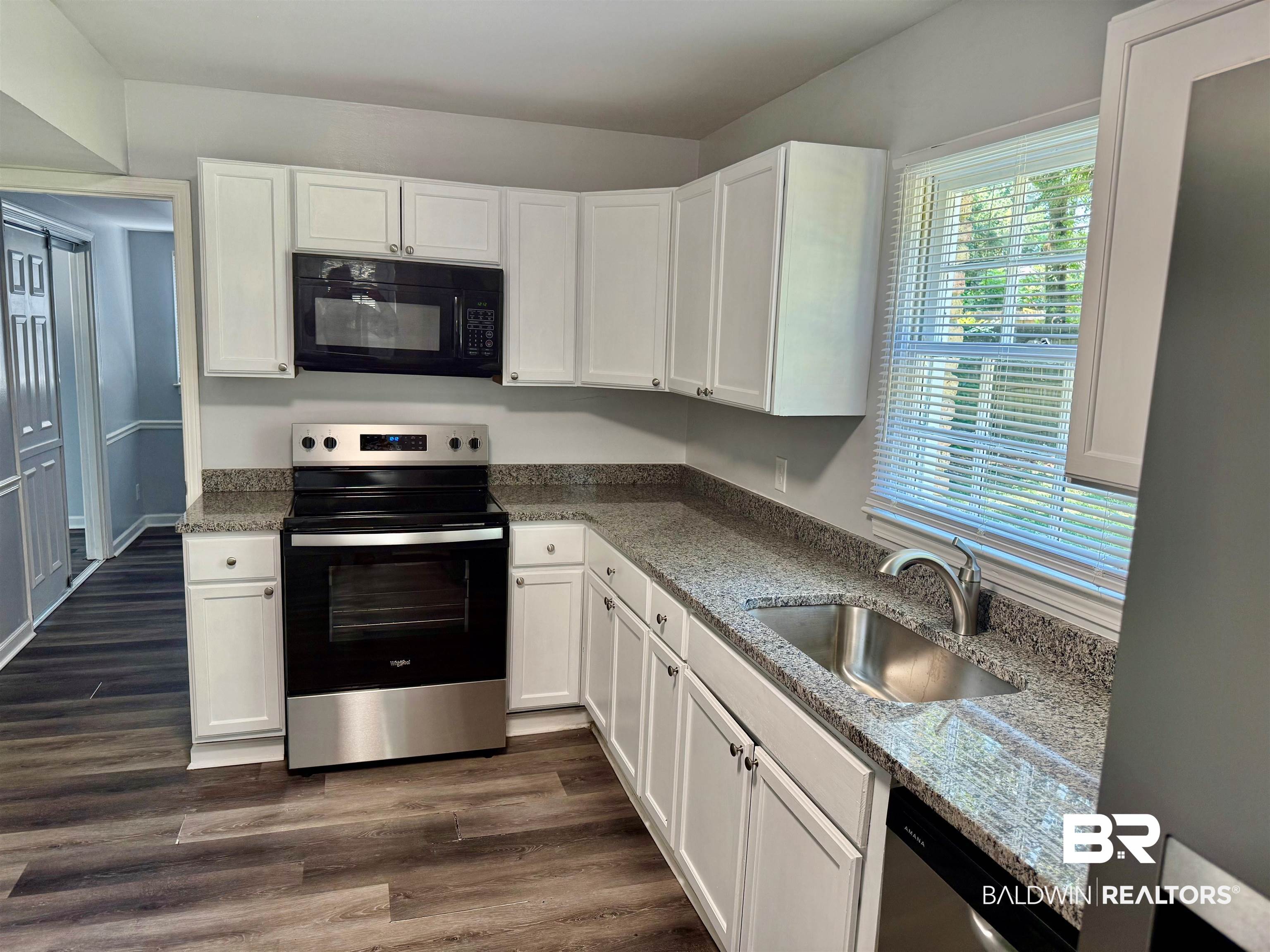 317 Syracuse Street Mobile, AL 36608 - Photo 6 of 27 White cabinets and granite countertops