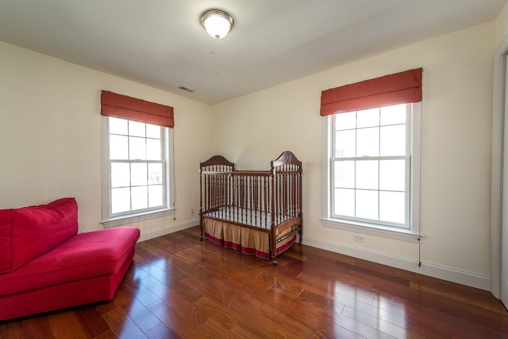 97 Boardman Street, Unit 97 Boston, MA 02128 - Photo 11 of 18 a living room with furniture and a window
