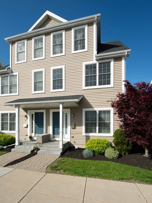 97 Boardman Street, Unit 97 Boston, MA 02128 - Photo 18 of 18 a front view of a house with a yard