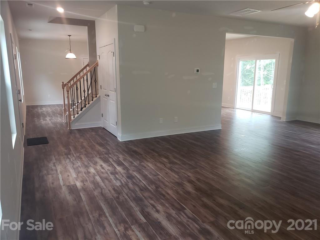 1806 Love Road Monroe, NC 28110 - Photo 3 of 20 a view of a hallway with wooden floor