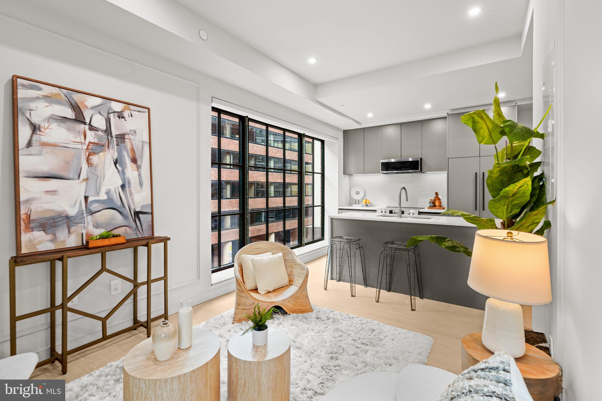 2121 Ward Place Northwest, Unit 403 Washington, DC 20037 - Photo 3 of 19 a living room with furniture and a window