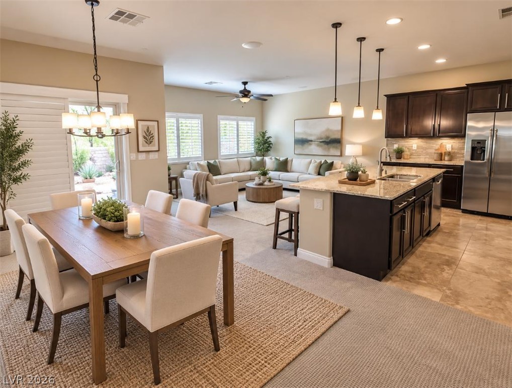 1509 Destiny Ridge Court Henderson, NV 89074 - Photo 30 of 32 AI photo- An open-concept layout seamlessly connects the dining area, kitchen, and living space.