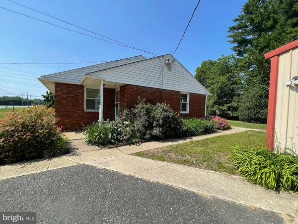 a front view of house with garden