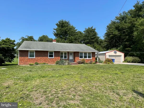 a front of a house with a garden