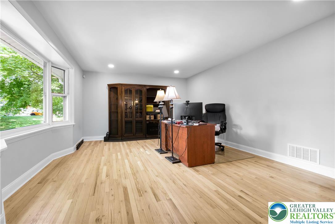 2011 Greenwood Road Allentown, PA 18103 - Photo 10 of 52 A versatile space features wide plank hardwood floors and a generously sized window, ideal for a home office.