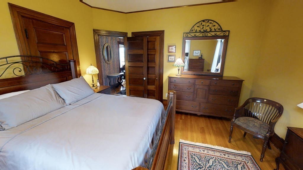 35 Renwick Road Melrose, MA 02176 - Photo 15 of 27 a bedroom with a bed dresser and a mirror