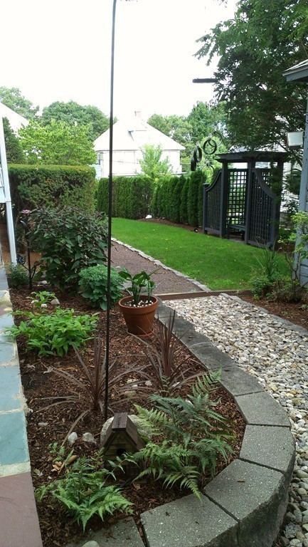 35 Renwick Road Melrose, MA 02176 - Photo 20 of 27 a view of a garden with a tree