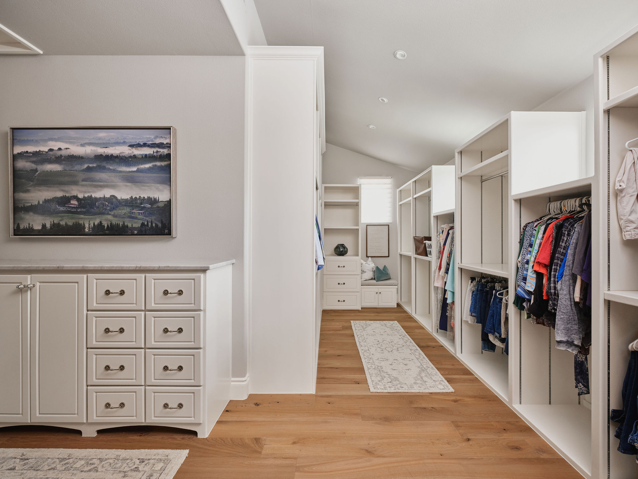 433 Brandon Way Austin, TX 78733 - Photo 20 of 40 Ample storage solutions and elegant hardwood flooring define this well-appointed walk-in closet.
