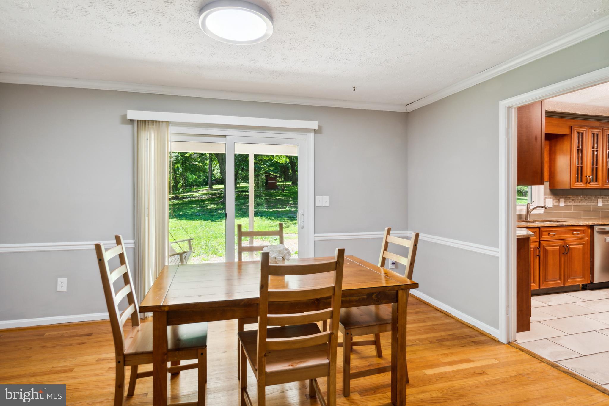 4412 Reels Mill Road Frederick, MD 21704 - Photo 8 of 37 Exit to outdoor patio from dining room