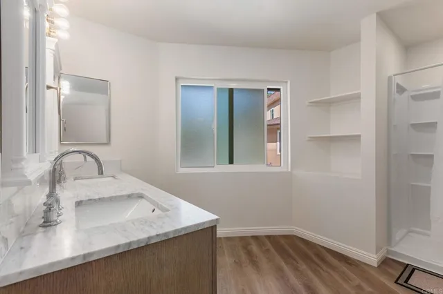 wooden floor in an empty room and a window
