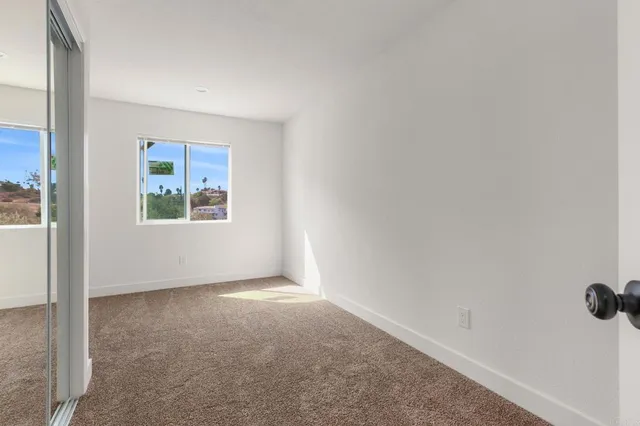 a view of balcony with wooden floor