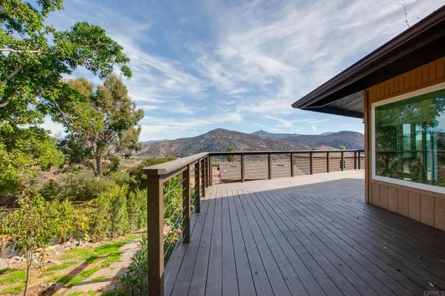 an aerial view of a house with a yard and garden