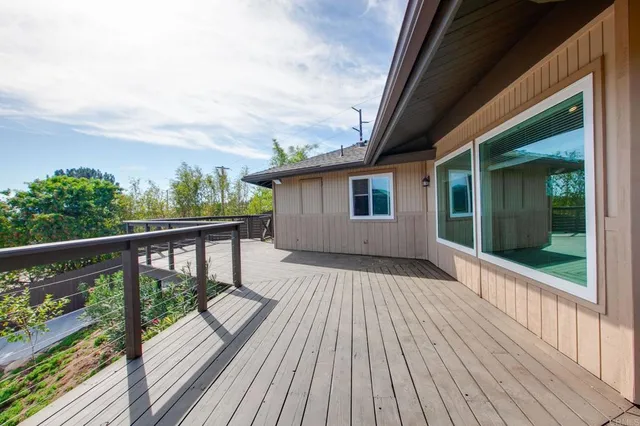an aerial view of a house with a yard and trees