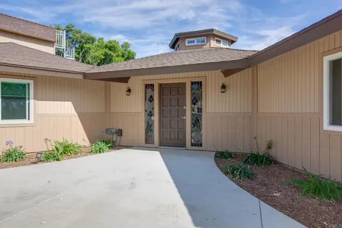 a front view of a house with a garage