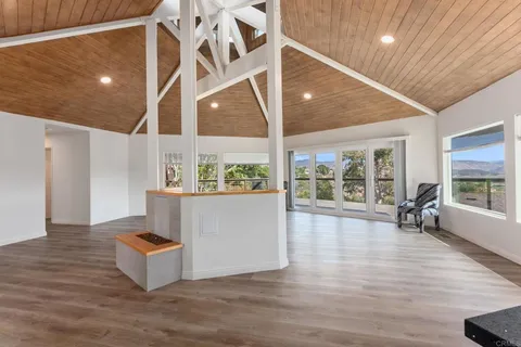 a view of workspace with wooden floor and windows
