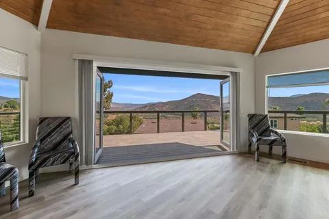 a view of livingroom with furniture wooden floor and windows