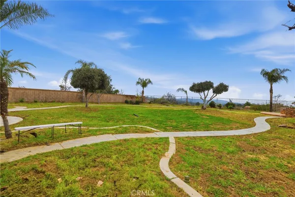 a view of a swimming pool with a yard