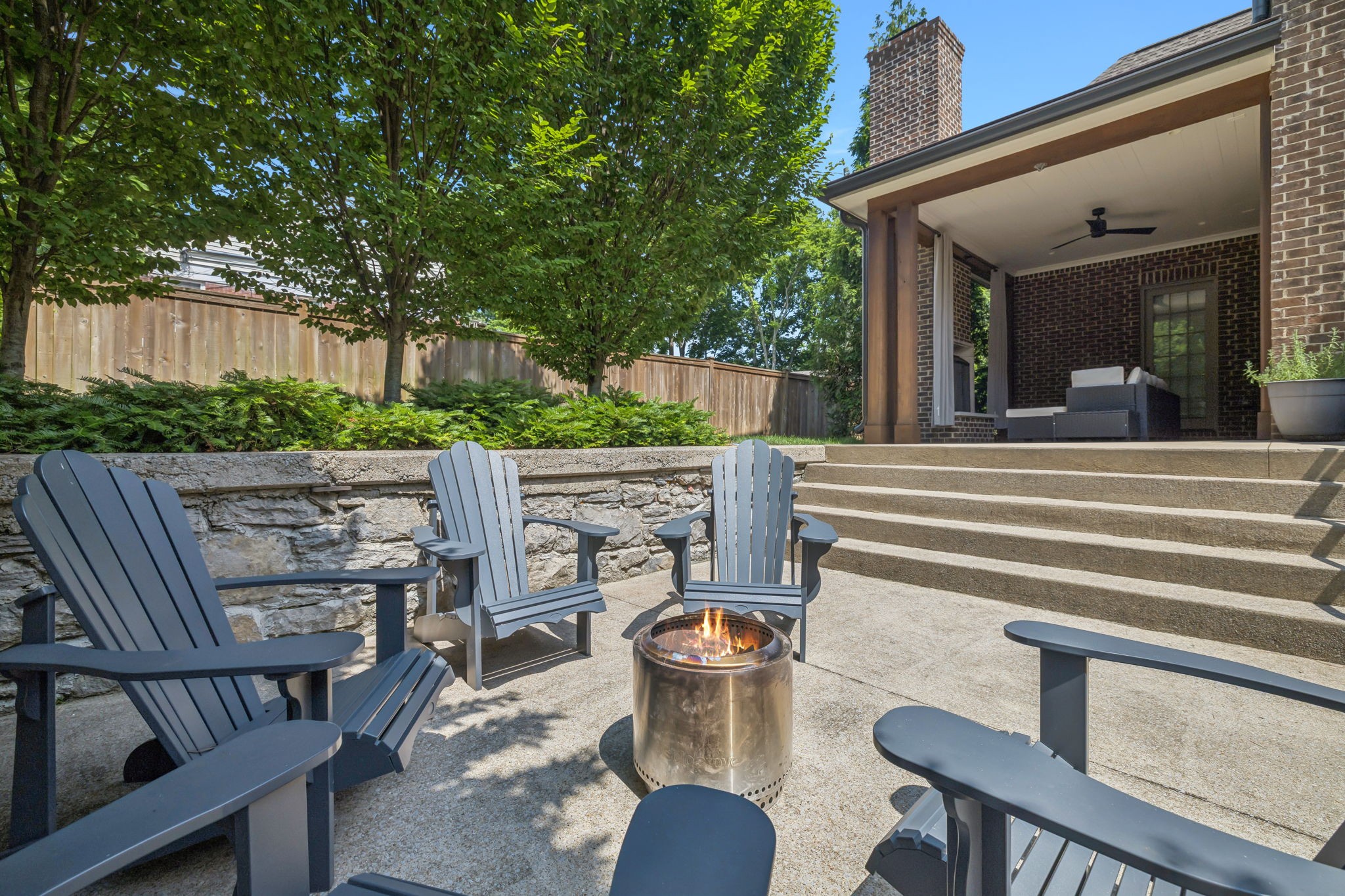 2401 Sterling Road Nashville, TN 37215 - Photo 11 of 92 a view of a patio with table and chairs and potted plants
