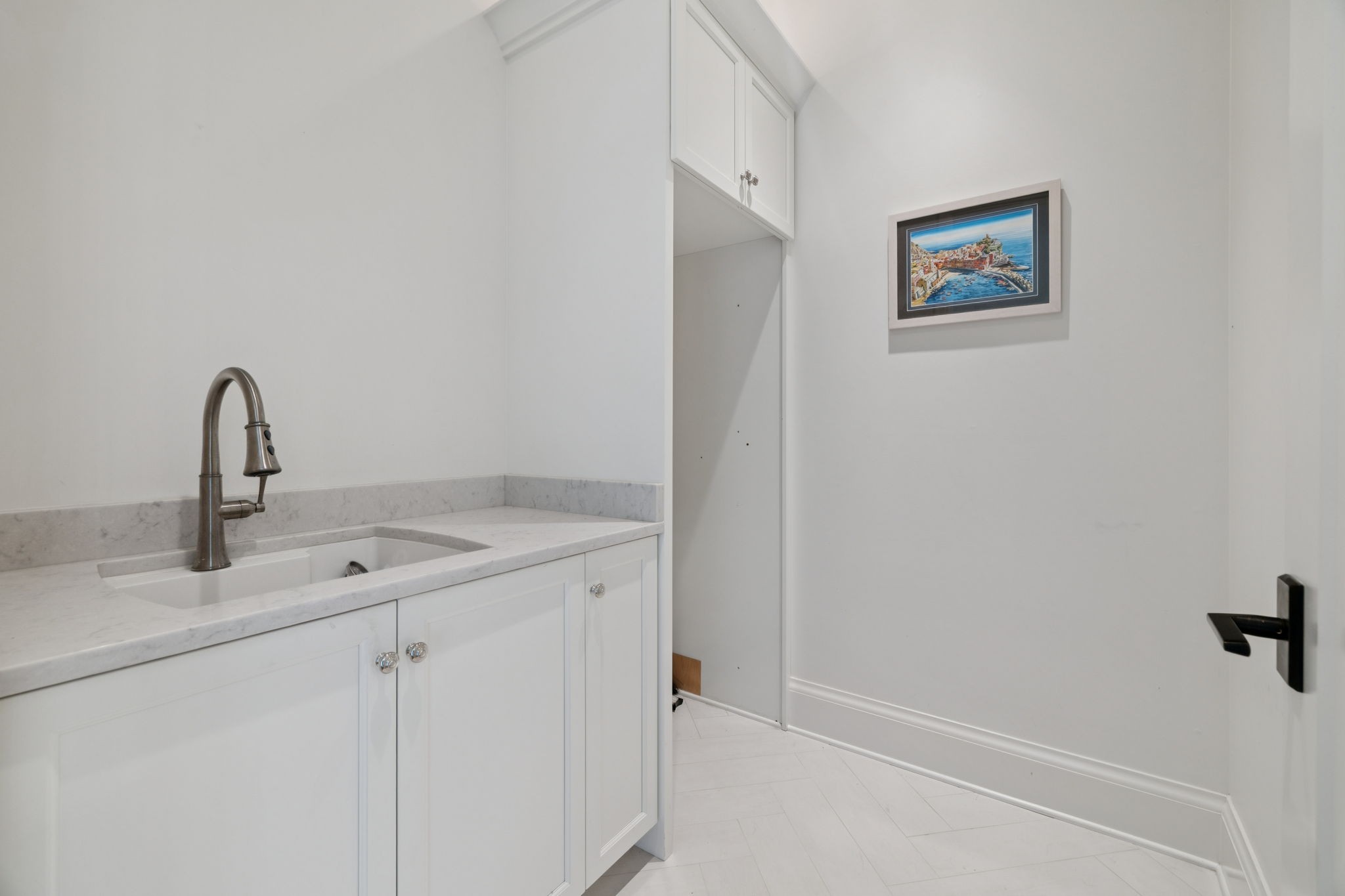 2401 Sterling Road Nashville, TN 37215 - Photo 56 of 92 a close view of a sink a faucet and cabinets in a room