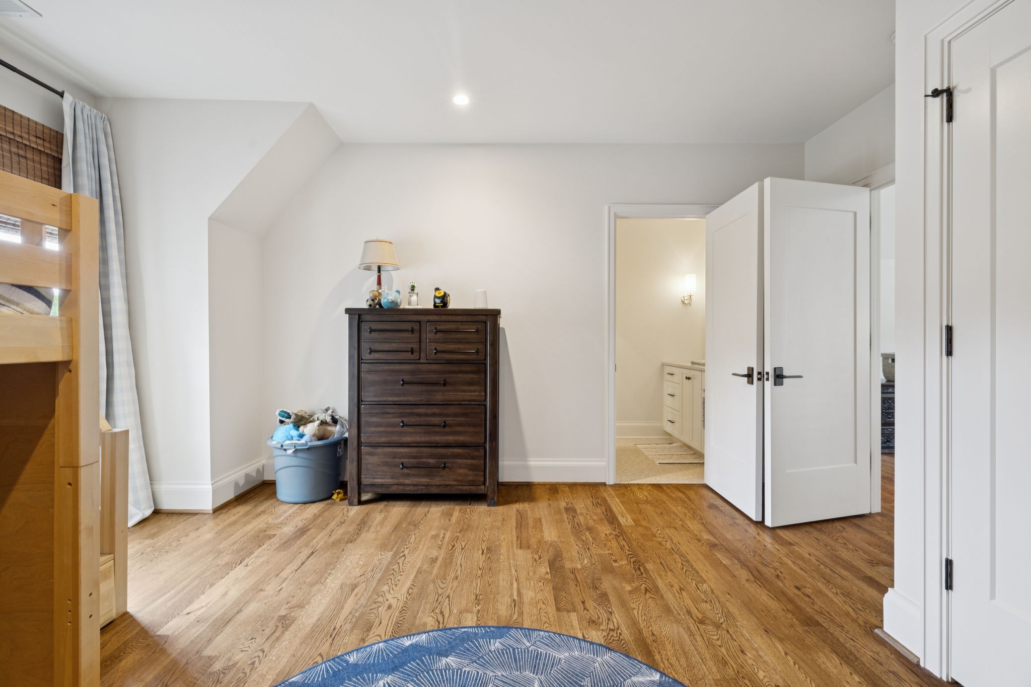 2401 Sterling Road Nashville, TN 37215 - Photo 77 of 92 a bedroom with a bed and wooden floor